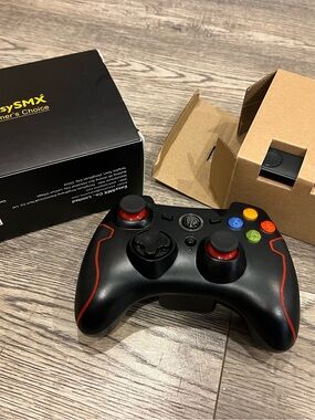 Amazon Black Wireless Game Controller with Red Accents and Colored Buttons